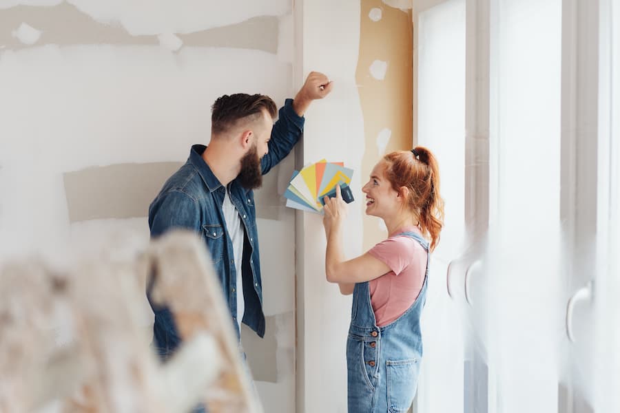 Couple picking out paint color